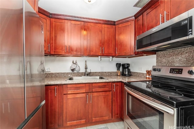 kitchen featuring appliances with stainless steel finishes and a sink