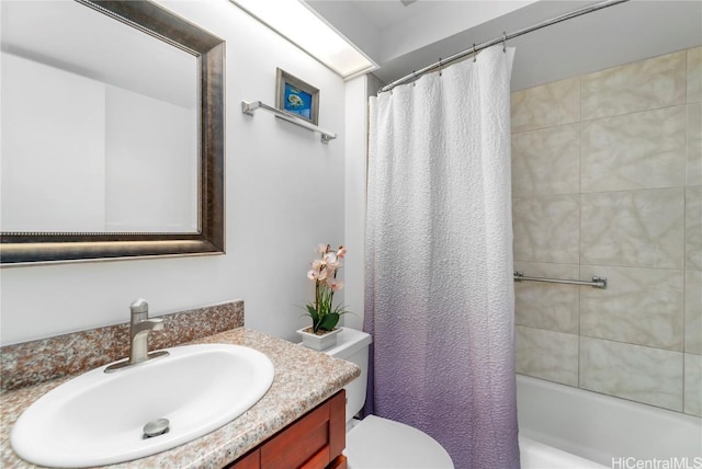 full bath featuring shower / bathtub combination with curtain, vanity, and toilet