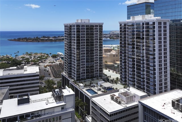 birds eye view of property with a water view and a city view