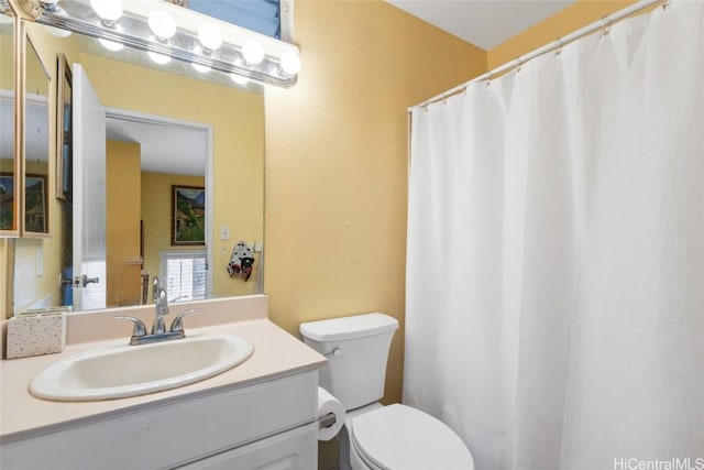 full bath with a shower with shower curtain, toilet, and vanity