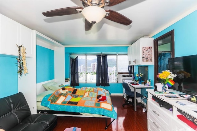 bedroom featuring a ceiling fan and dark wood finished floors