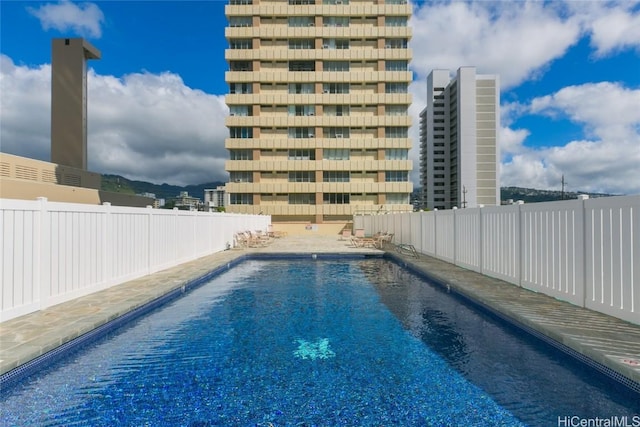 community pool featuring fence