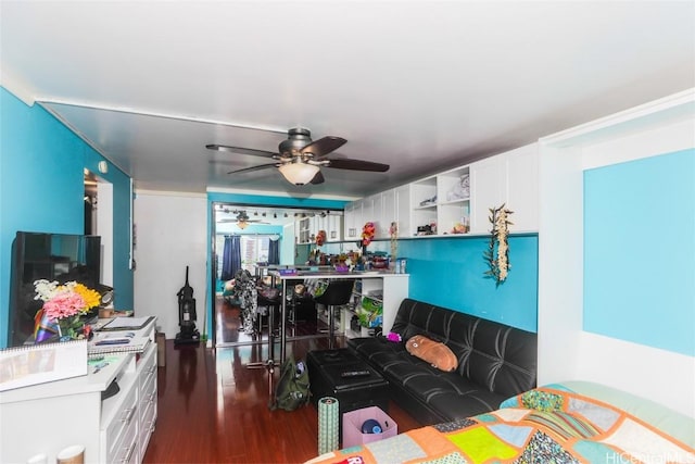 bedroom with a ceiling fan and wood finished floors