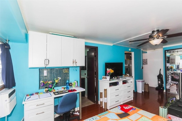 home office with ceiling fan and dark wood-type flooring