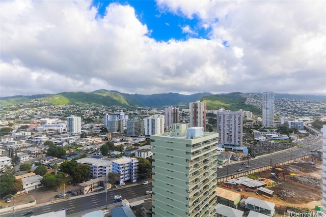 property's view of city with a mountain view