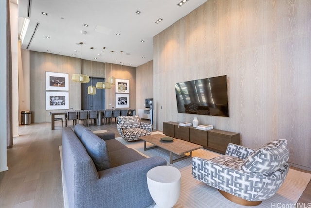 living room with recessed lighting and wood finished floors