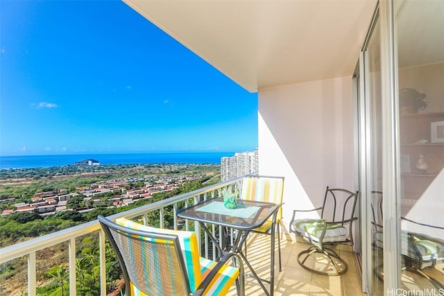 balcony featuring a water view and a view of city