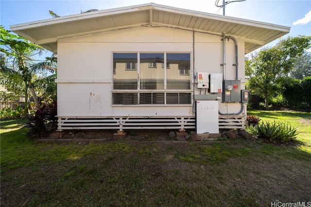 back of house with a yard