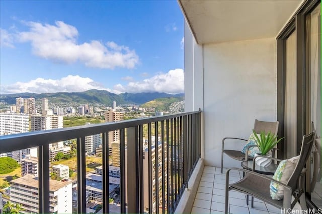 balcony featuring a view of city and a mountain view