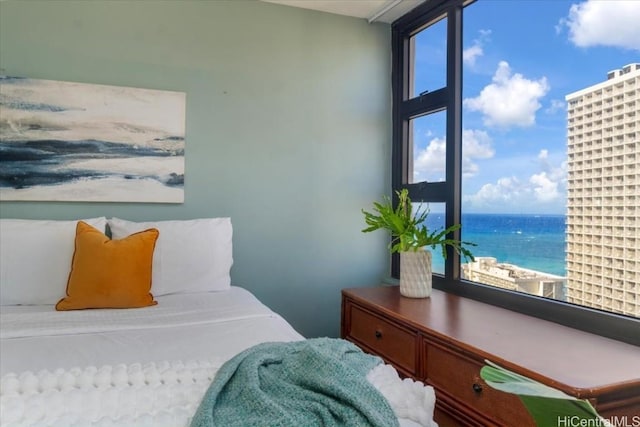 bedroom featuring a water view