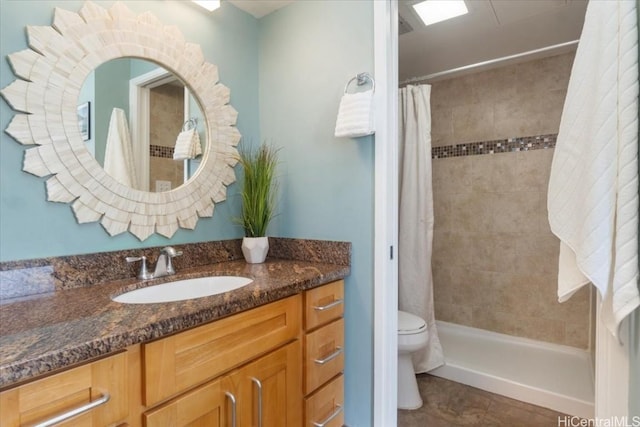 full bath with tile patterned flooring, a shower stall, toilet, and vanity