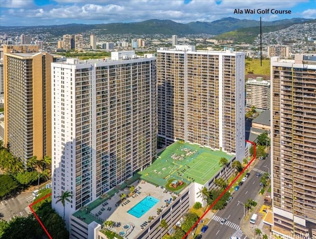 aerial view with a mountain view and a city view