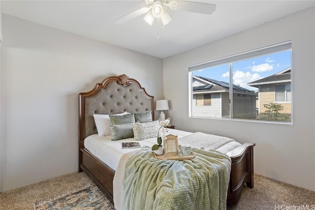 bedroom with a ceiling fan and carpet flooring