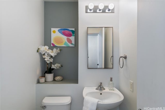 bathroom with a sink and toilet