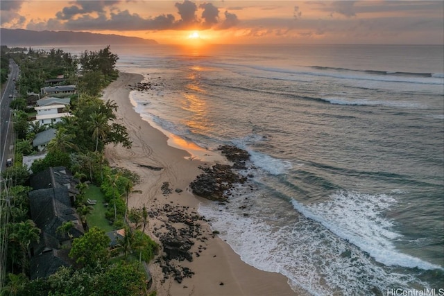 exterior space featuring a beach view and a water view