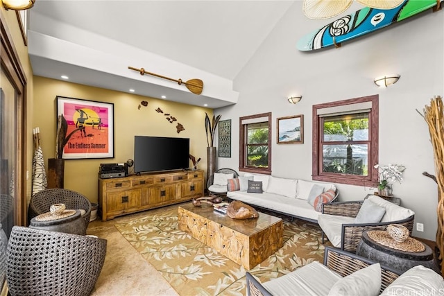 living area featuring carpet floors and high vaulted ceiling