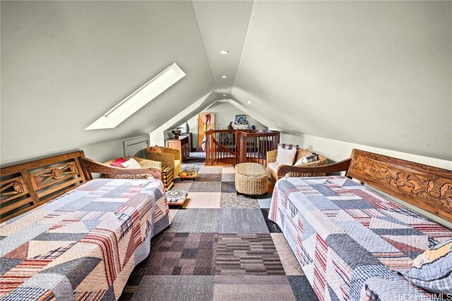 bedroom with vaulted ceiling with skylight