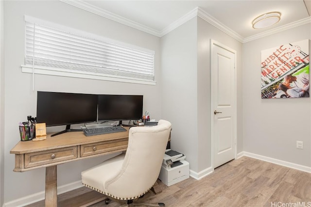 office with crown molding, light wood-style floors, and baseboards