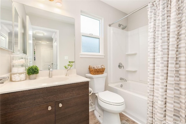 bathroom with shower / tub combo with curtain, toilet, vanity, and wood finished floors