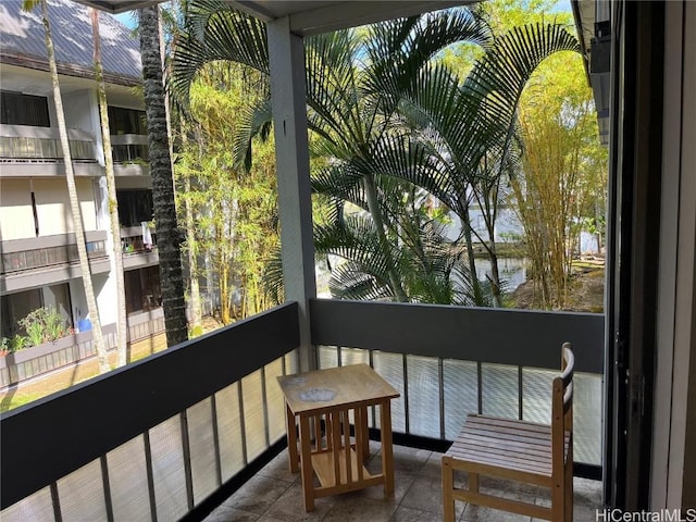 balcony featuring a water view