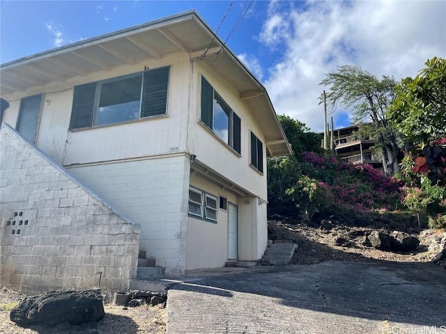 view of property exterior featuring a garage