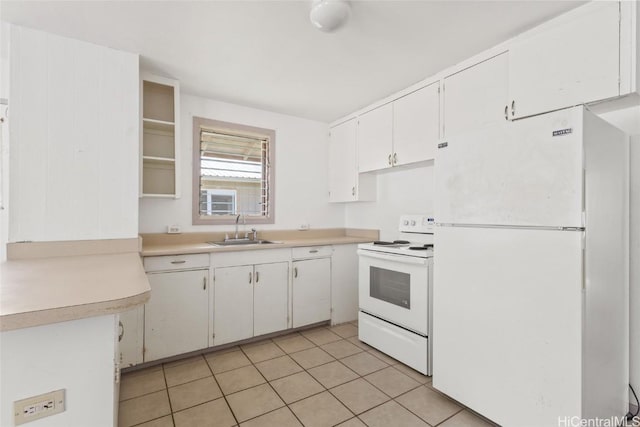 kitchen with a sink, white appliances, white cabinets, light tile patterned flooring, and light countertops