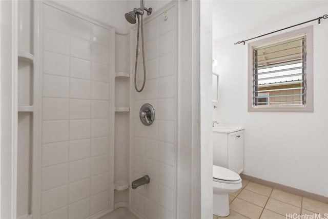 bathroom with tile patterned flooring, baseboards, walk in shower, toilet, and vanity