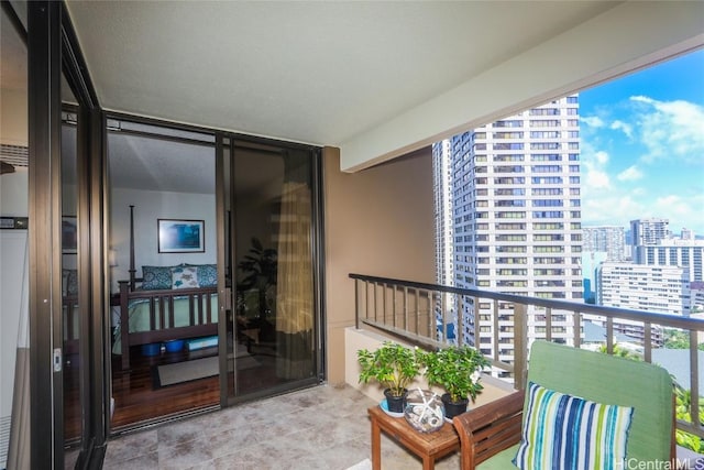 balcony featuring a view of city