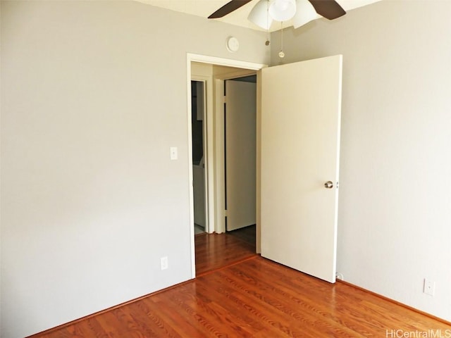 unfurnished room featuring ceiling fan and wood finished floors