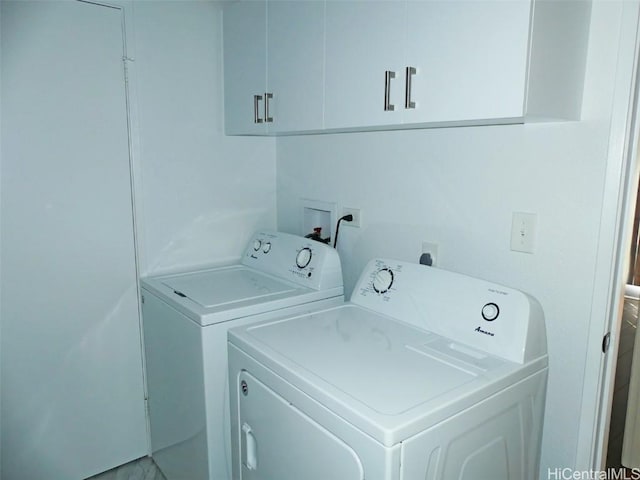 laundry room with cabinet space and washing machine and dryer