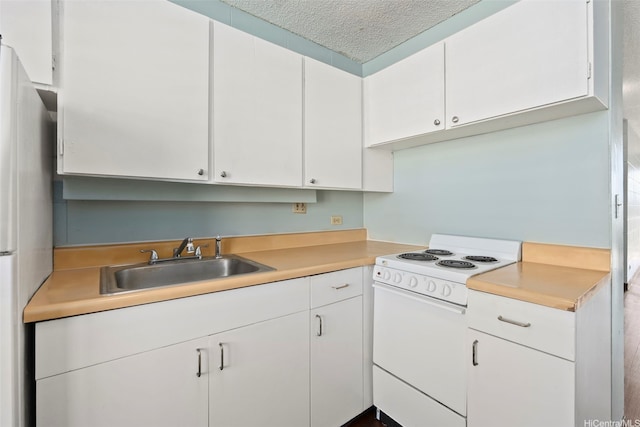 94-246 Leoku St Unit E306, Waipahu, HI 96797 - kitchen featuring electric range, light countertops, white cabinetry, and a textured ceiling