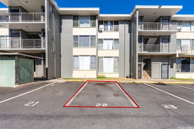 94-246 Leoku St Unit E306, Waipahu, HI 96797 - view of apartment building / complex featuring uncovered parking