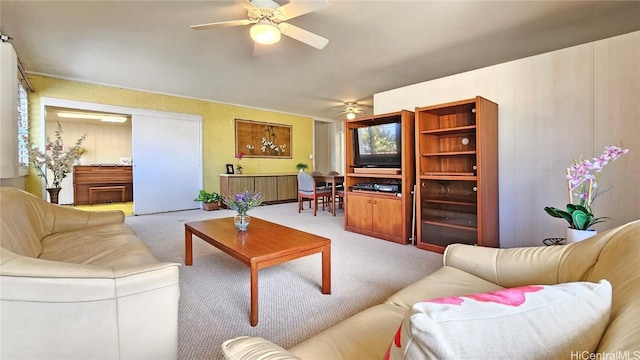 living room with carpet and ceiling fan