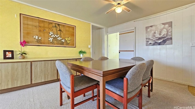 dining room featuring light colored carpet and ceiling fan