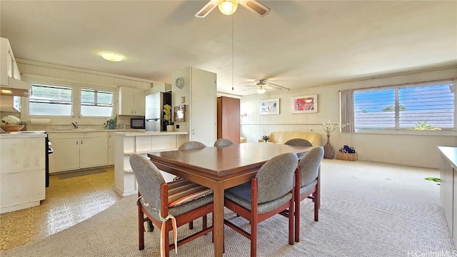 dining area with a ceiling fan