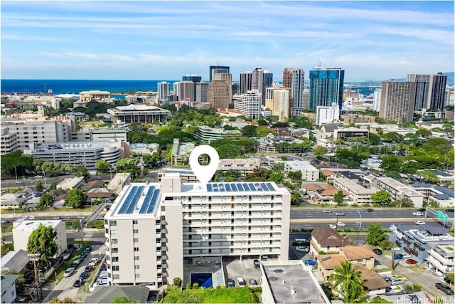 drone / aerial view featuring a view of city and a water view