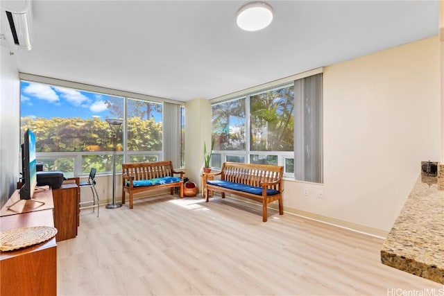 sunroom featuring a wall mounted air conditioner