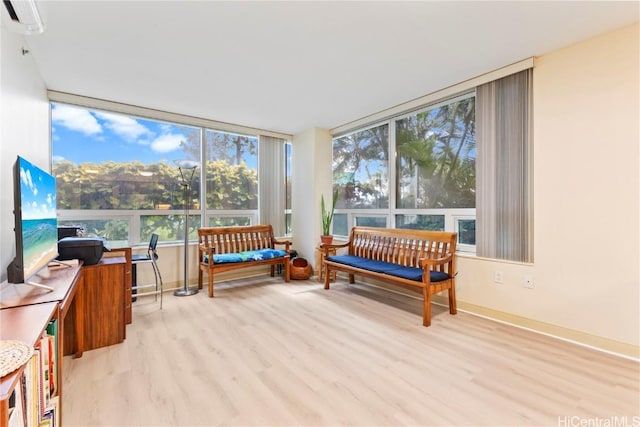 sunroom with a wall mounted AC