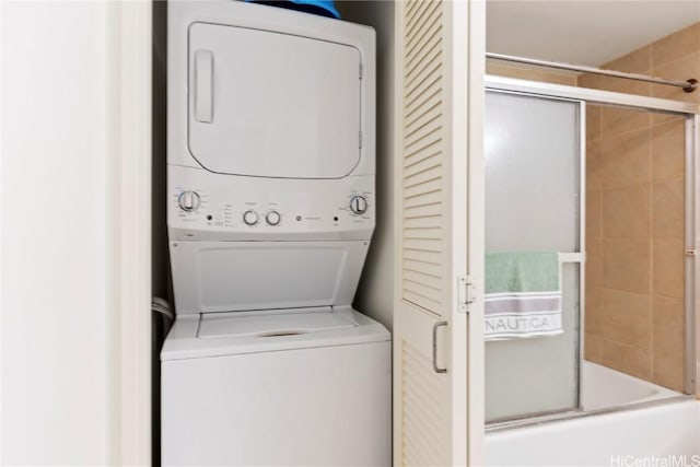 laundry room featuring laundry area and stacked washer and clothes dryer