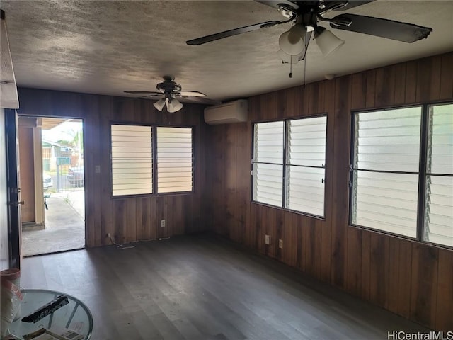 unfurnished sunroom featuring an AC wall unit and ceiling fan