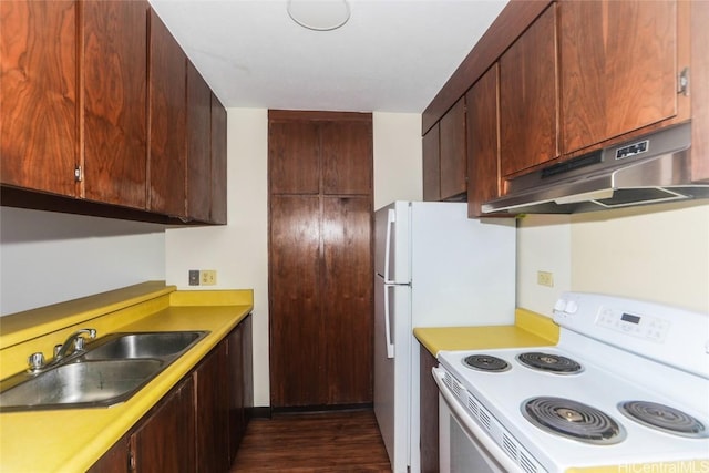 kitchen featuring under cabinet range hood, a sink, white range with electric stovetop, light countertops, and dark wood-style flooring
