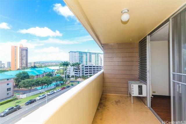 balcony with a city view and cooling unit