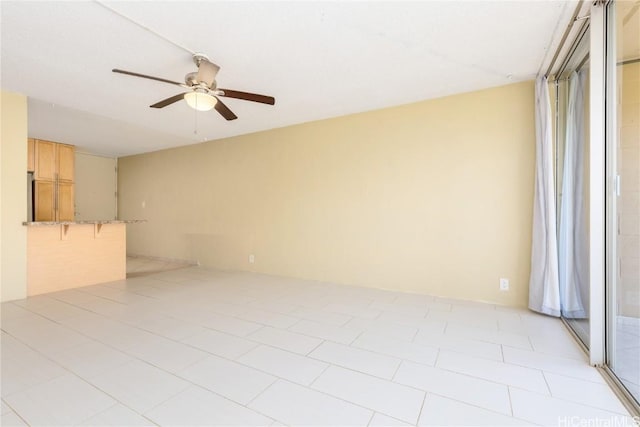 spare room with a ceiling fan