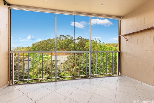 unfurnished sunroom featuring plenty of natural light