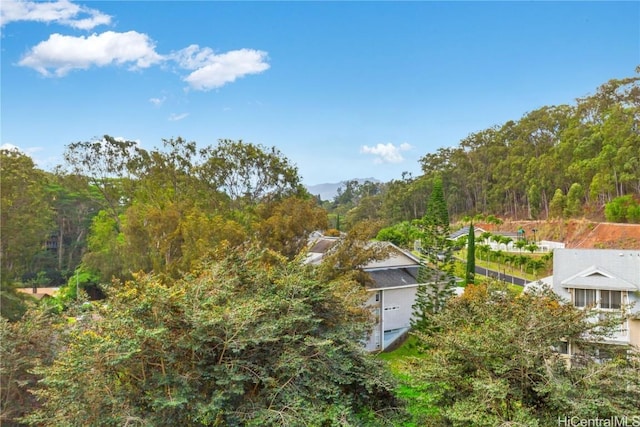 exterior space with a forest view