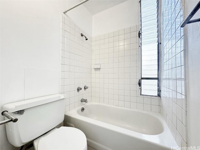 bathroom with toilet and  shower combination