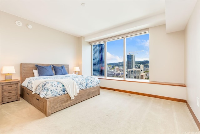 1555 Kapiolani Blvd Unit 1900, Honolulu, HI 96814 - bedroom featuring light colored carpet, a view of city, and baseboards