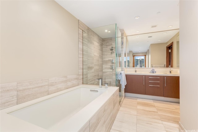 1555 Kapiolani Blvd Unit 1900, Honolulu, HI 96814 - full bath featuring a stall shower, a bath, double vanity, recessed lighting, and tile patterned floors