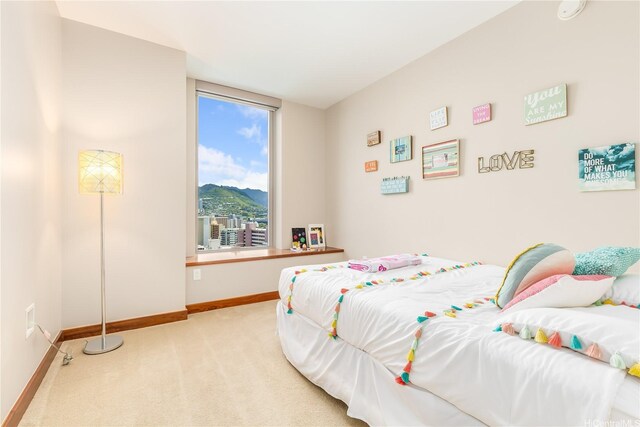 1555 Kapiolani Blvd Unit 1900, Honolulu, HI 96814 - bedroom featuring carpet, baseboards, and a mountain view
