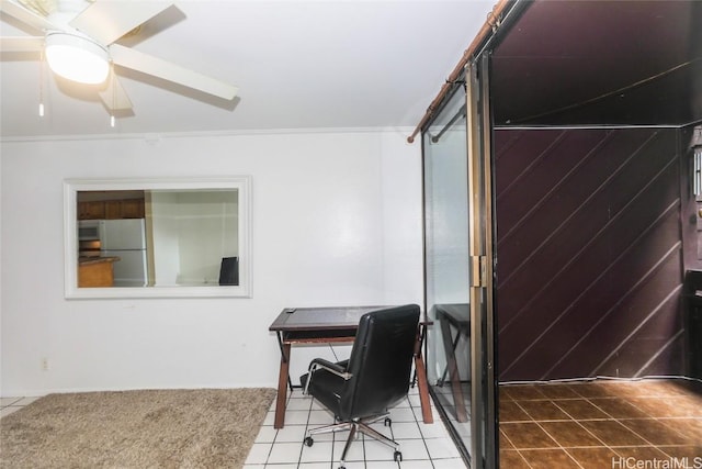 tiled office with ceiling fan and ornamental molding